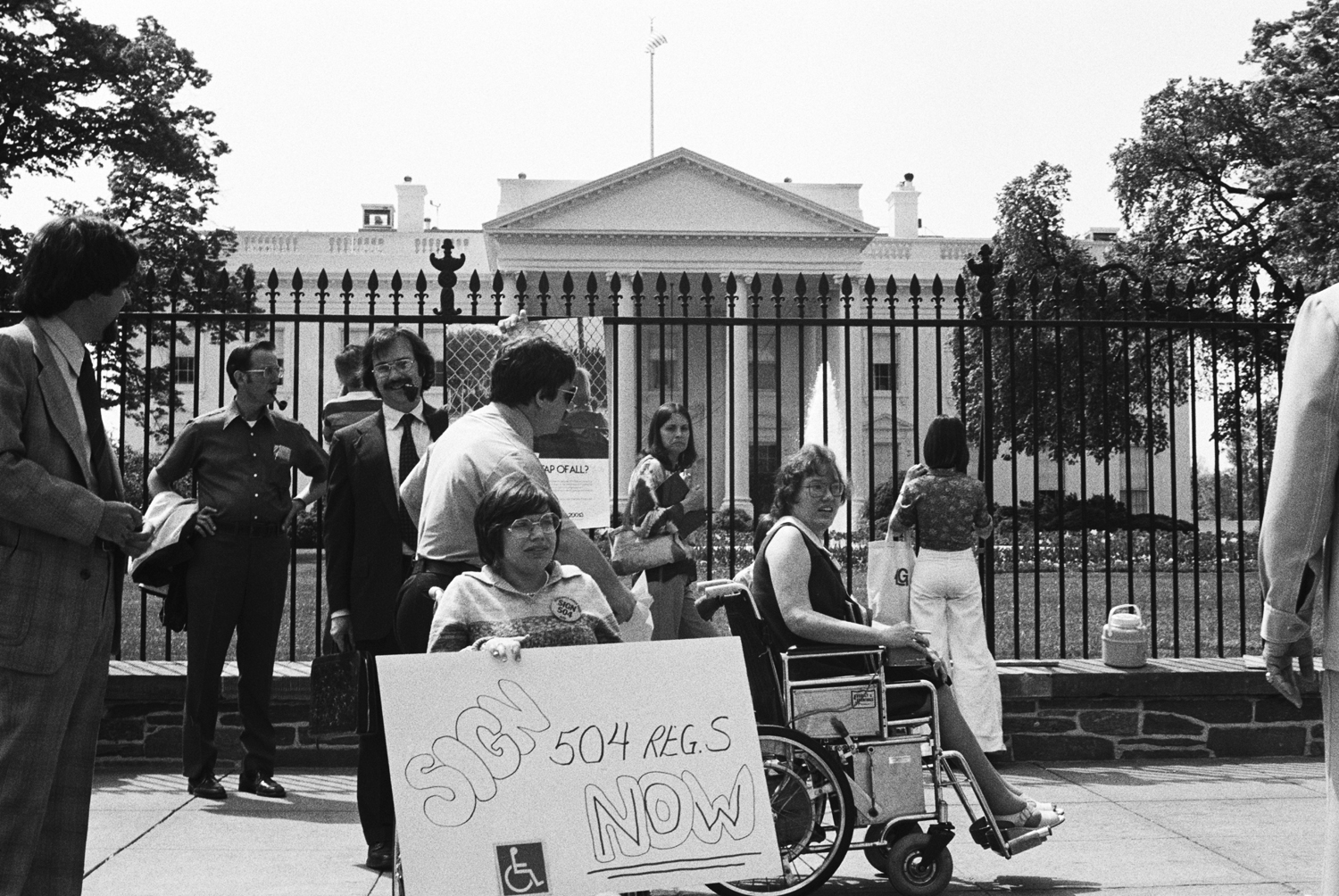 Protestors with signs outside white house